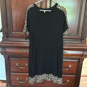 Celeste short sleeved dress. Leopard print details down shoulders & @ hemline.